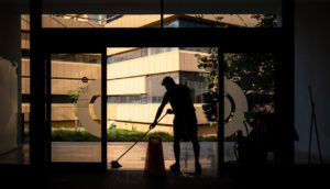 man cleaning door